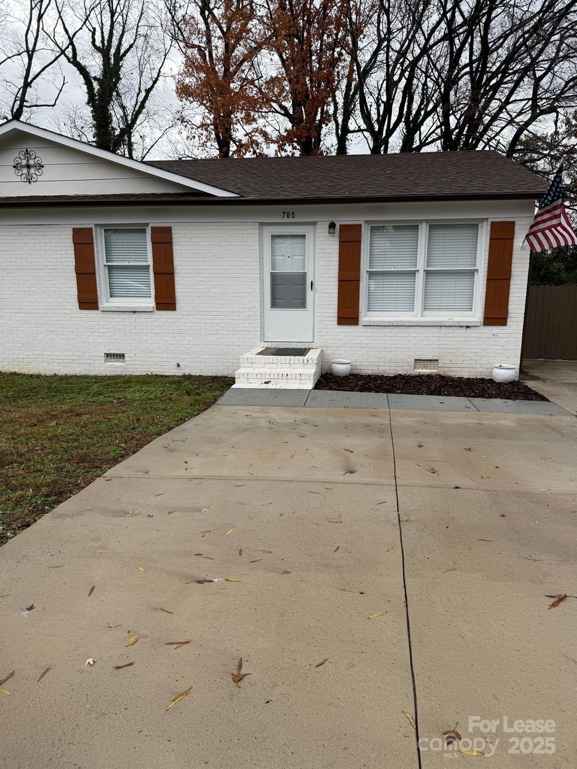 a house with trees in the background