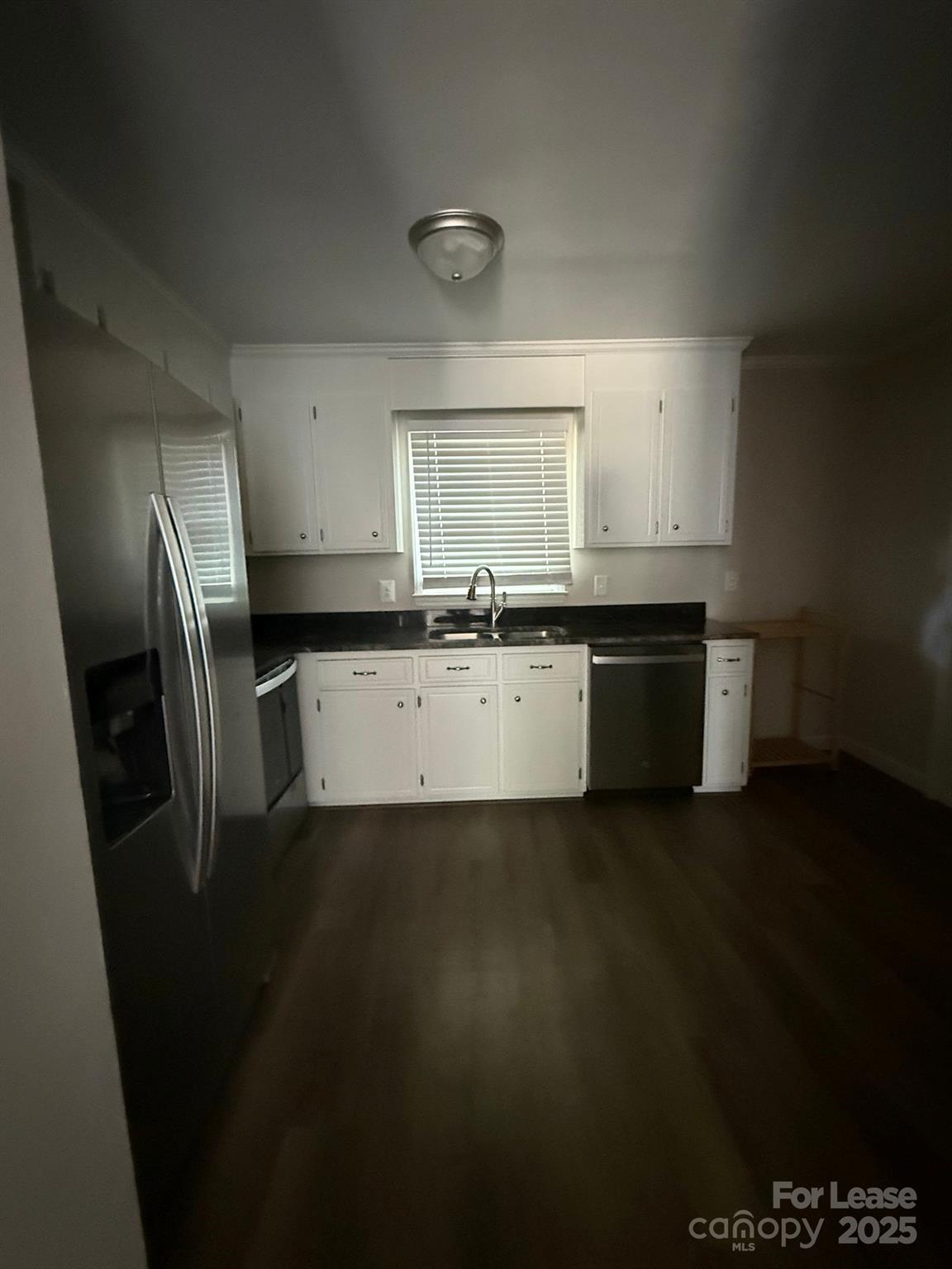 705 Oakshade Avenue Kannapolis, NC 28083 - Photo 17 of 21 a kitchen with a sink a refrigerator and cabinets