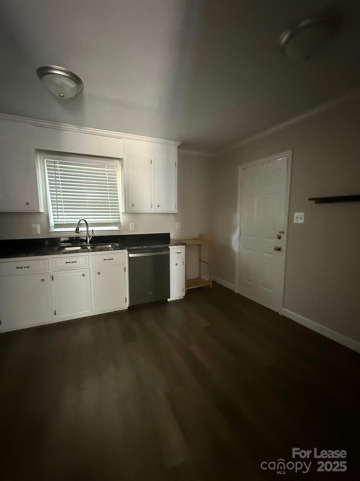 705 Oakshade Avenue Kannapolis, NC 28083 - Photo 18 of 21 a kitchen with stainless steel appliances a sink stove and cabinets