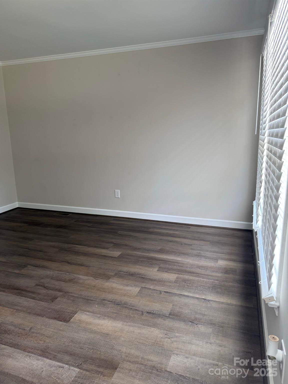705 Oakshade Avenue Kannapolis, NC 28083 - Photo 20 of 21 a view of an empty room and wooden floor