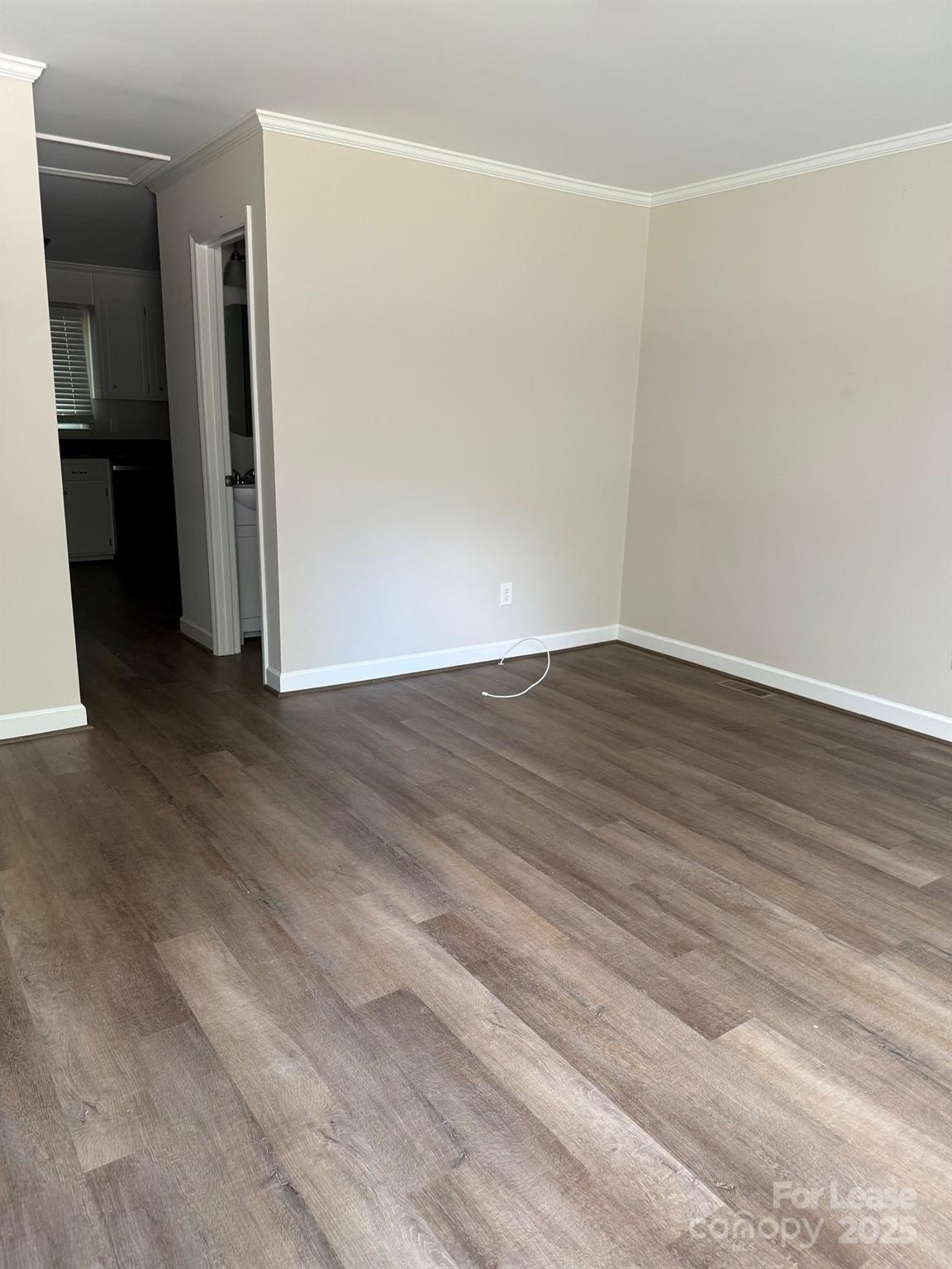705 Oakshade Avenue Kannapolis, NC 28083 - Photo 21 of 21 an empty room with wooden floor and closet
