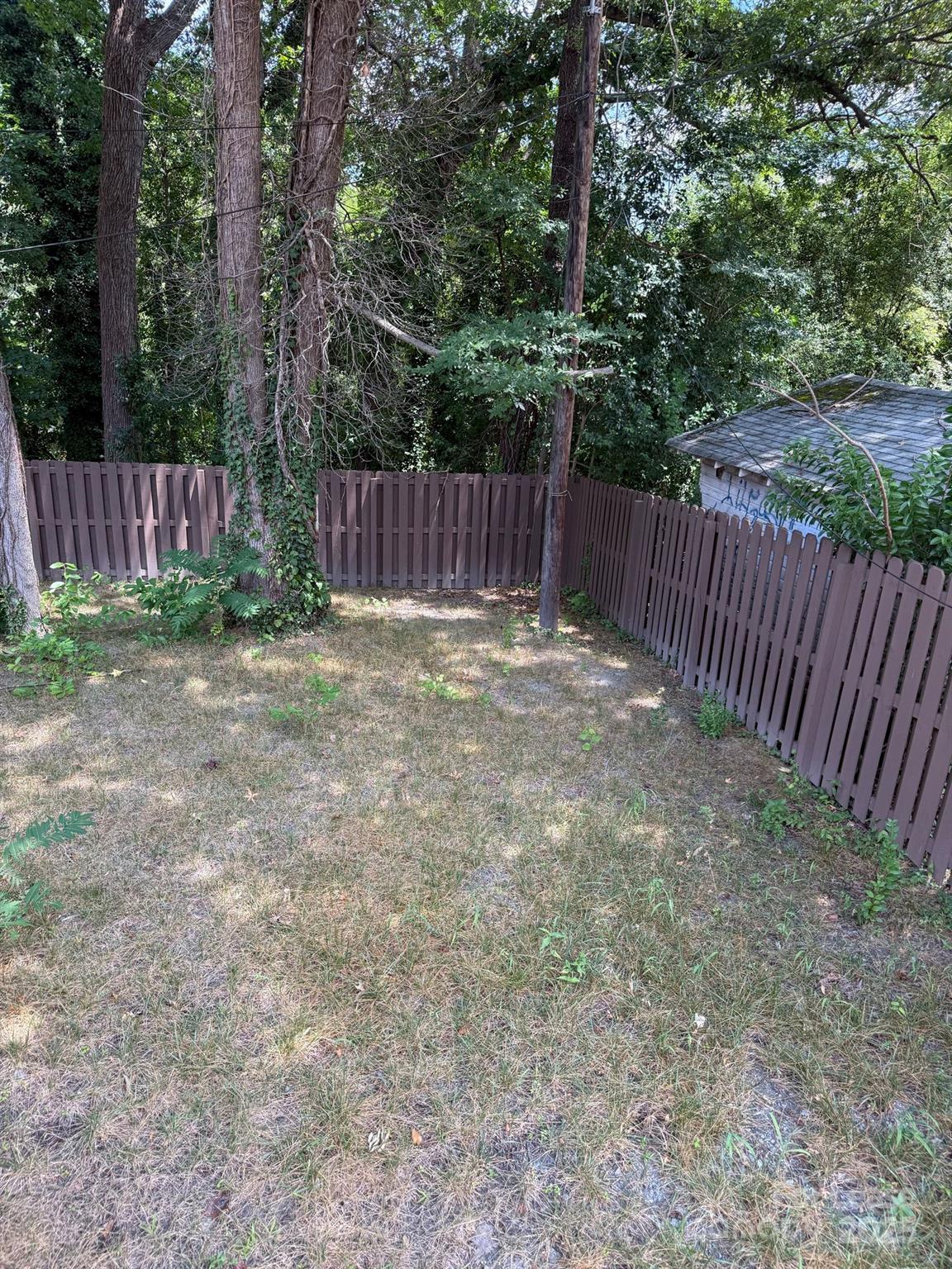 705 Oakshade Avenue Kannapolis, NC 28083 - Photo 3 of 21 a view of outdoor space with wooden fence