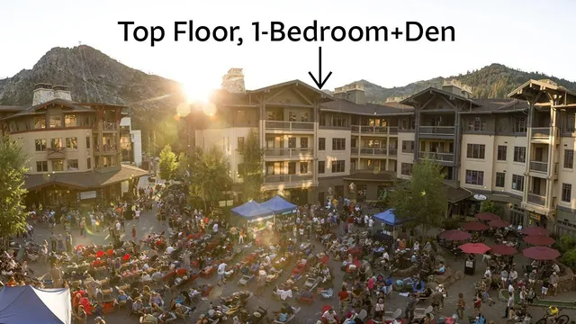 a view of a big house with a mountain in the background