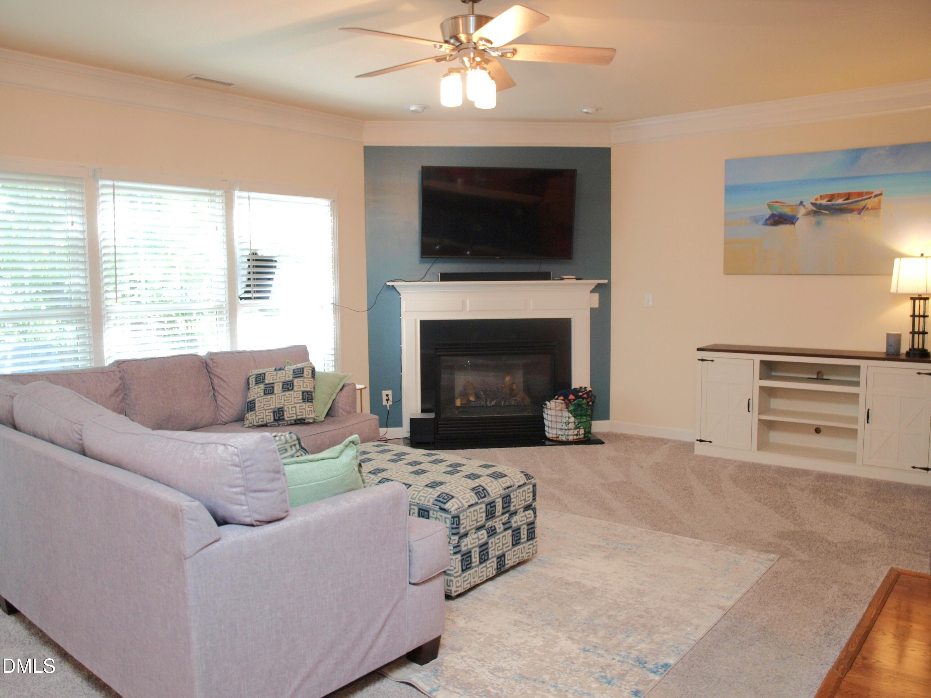 5206 Rio Grande Drive Raleigh, NC 27616 - Photo 10 of 37 a living room with furniture and a fireplace