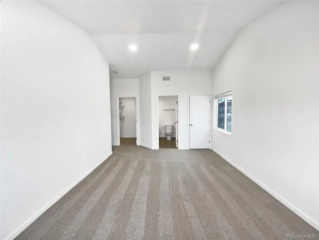 a view of an empty room and window