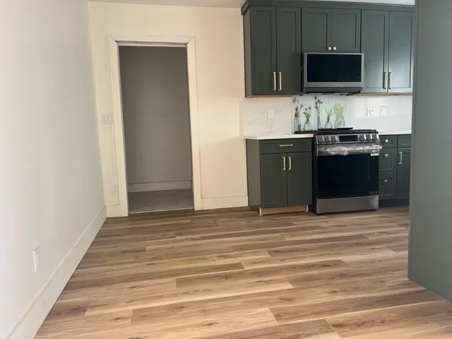 a view of a kitchen from the hallway
