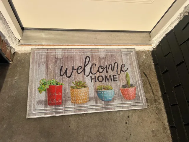 a view of a door and a window