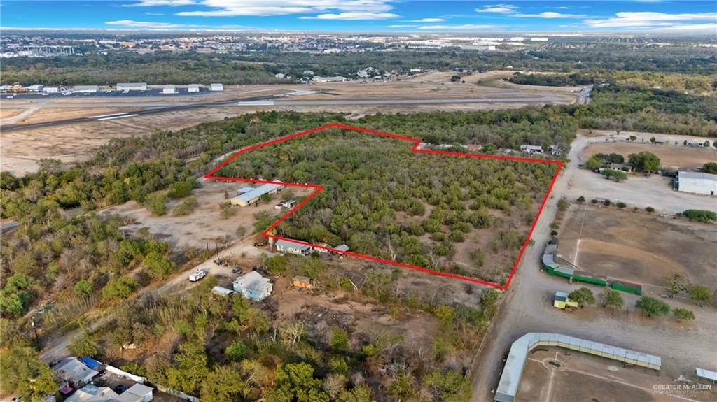 1706 East Ashley Road San Antonio, TX 78214 - Photo 8 of 16 Expansive undeveloped land parcel outlined in red, featuring significant tree coverage and natural terrain