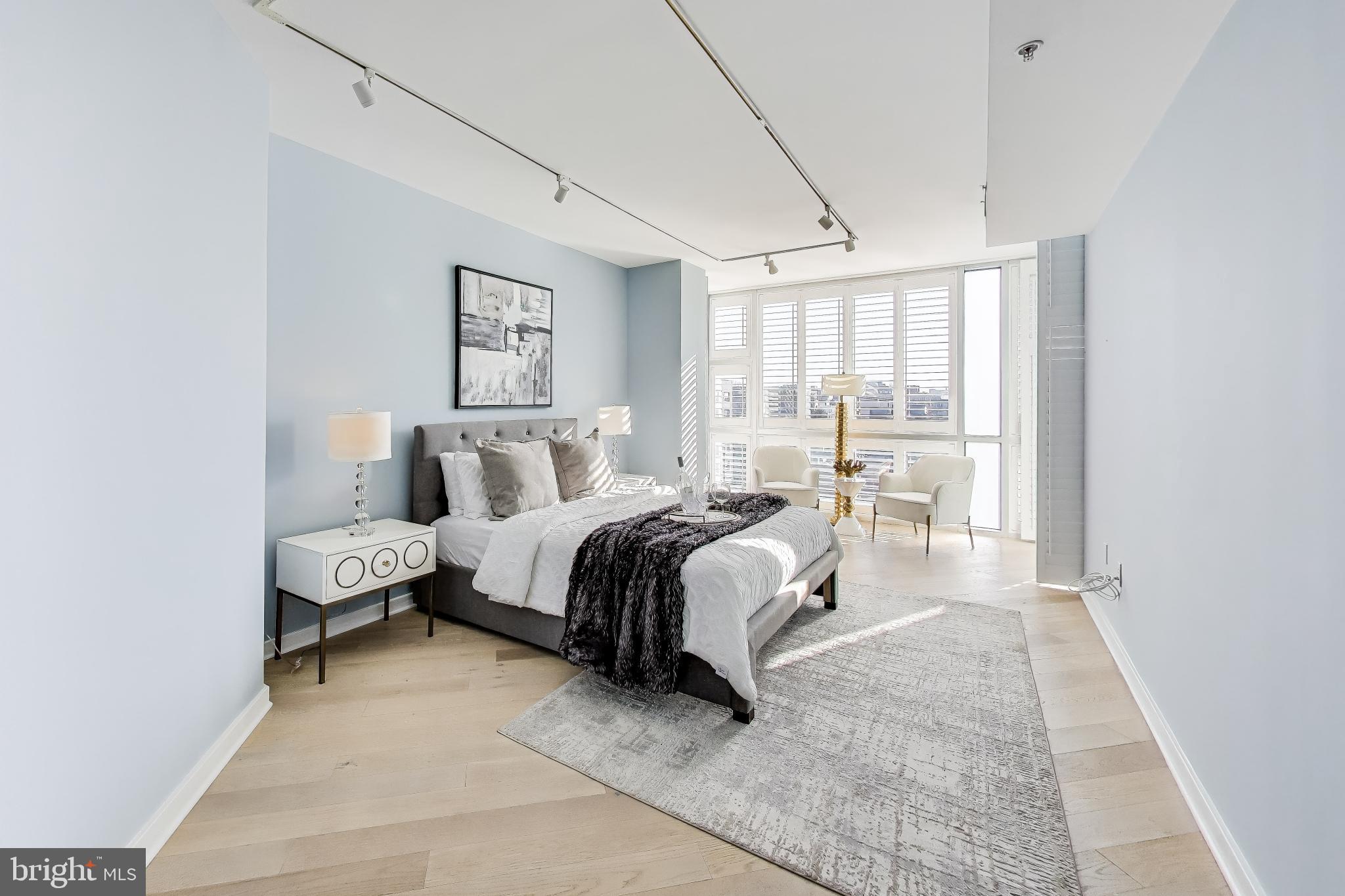 1300 13th Street Northwest, Unit 601 Washington, DC 20005 - Photo 14 of 35 Bright primary bedroom with a wall of windows