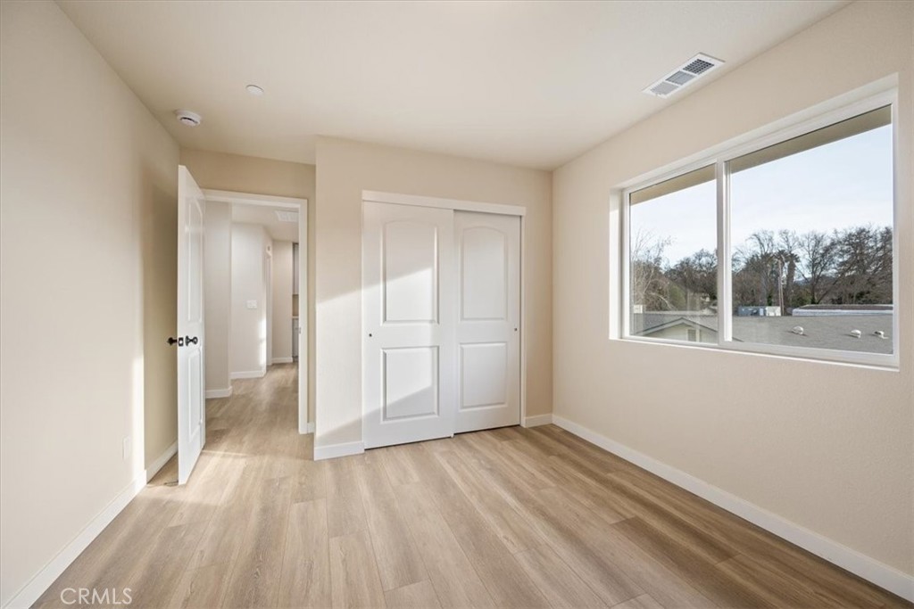 8397 Amapoa Atascadero, CA 93422 - Photo 24 of 34 a view of empty room with wooden floor and fan
