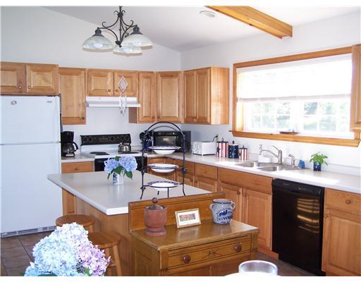 7 Fort Point Cove Road Stockton Springs, ME 04981 - Photo 8 of 21 Kitchen. Sunlight abounds in this...