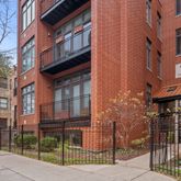 a view of a brick buidling front with many windows