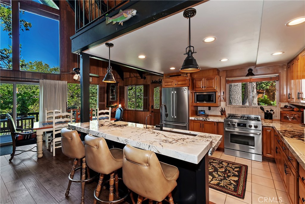 158 Golf Course Road Lake Arrowhead, CA 92391 - Photo 12 of 75 a view of a dining room with furniture window and wooden floor