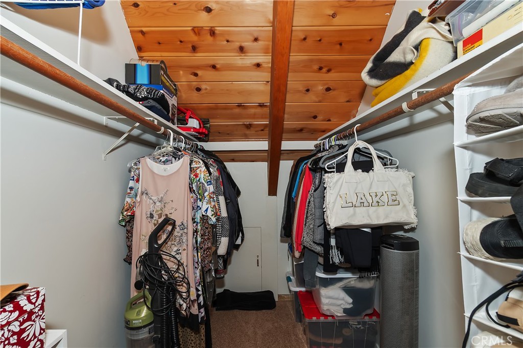158 Golf Course Road Lake Arrowhead, CA 92391 - Photo 28 of 75 a view of walk in closet with clothes and shoes