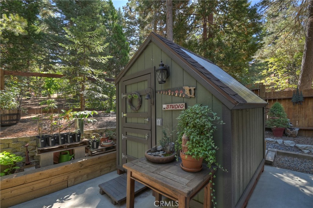 158 Golf Course Road Lake Arrowhead, CA 92391 - Photo 46 of 75 a front view of a house with garden