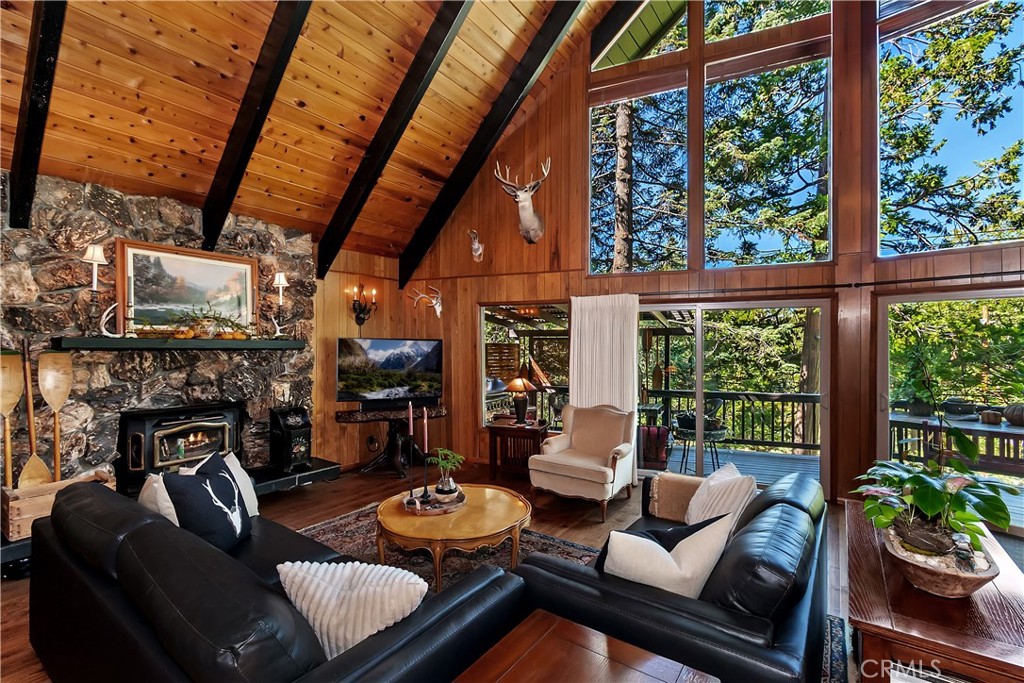 158 Golf Course Road Lake Arrowhead, CA 92391 - Photo 6 of 75 a living room with fireplace furniture and a flat screen tv
