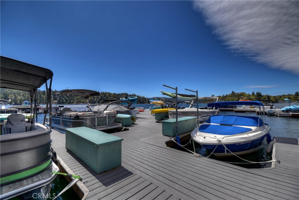 158 Golf Course Road Lake Arrowhead, CA 92391 - Photo 69 of 75 a view of a patio with lawn chairs and a barbeque