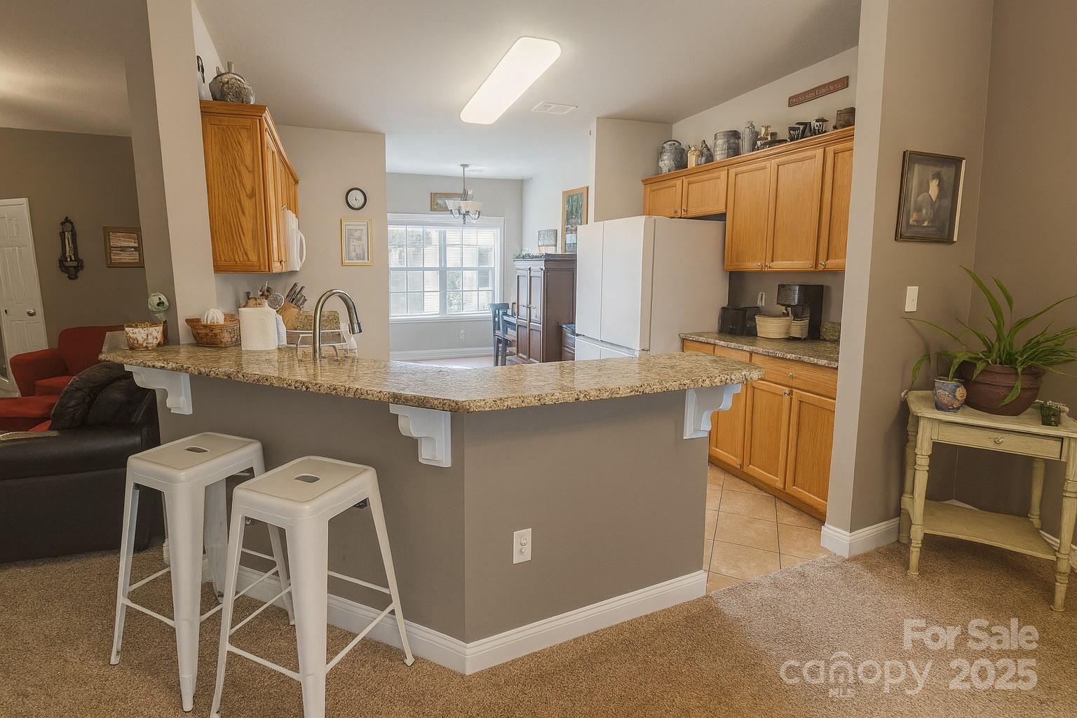 1350 21st Avenue Northeast Hickory, NC 28601 - Photo 11 of 27 a kitchen with granite countertop a sink appliances cabinets and furniture