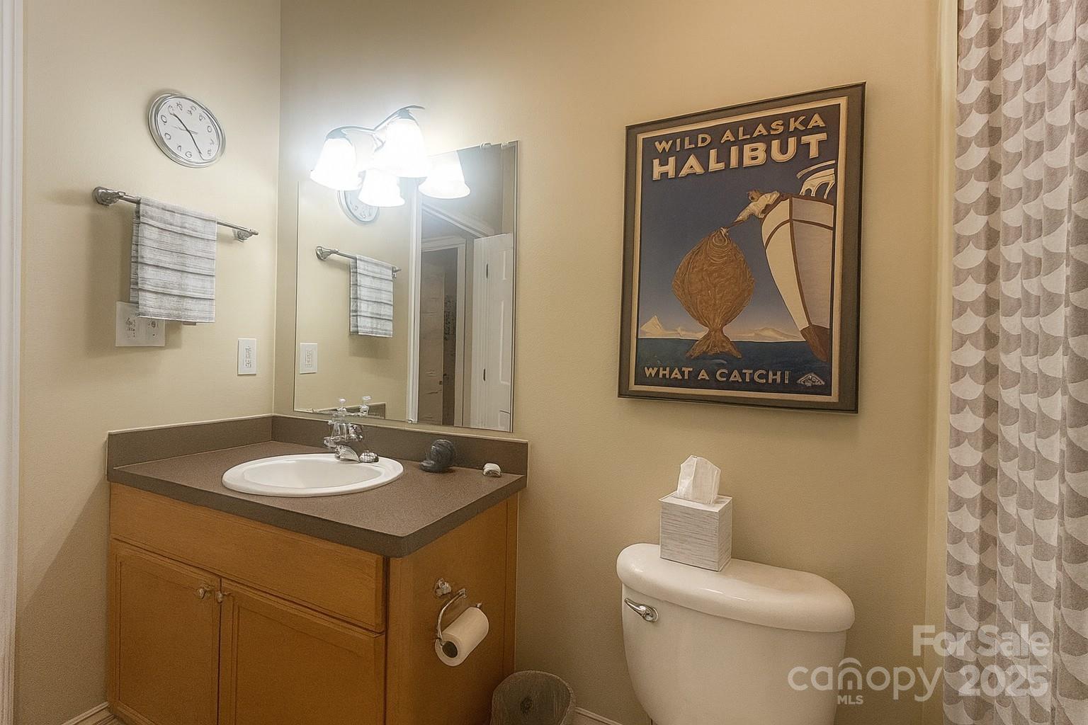 1350 21st Avenue Northeast Hickory, NC 28601 - Photo 26 of 27 a bathroom with a toilet sink vanity and mirror