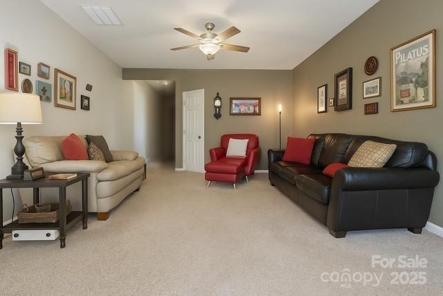 1350 21st Avenue Northeast Hickory, NC 28601 - Photo 6 of 27 a living room with furniture and a chandelier