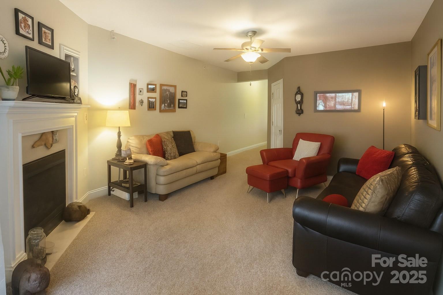 1350 21st Avenue Northeast Hickory, NC 28601 - Photo 7 of 27 a living room with furniture a flat screen tv and a fireplace