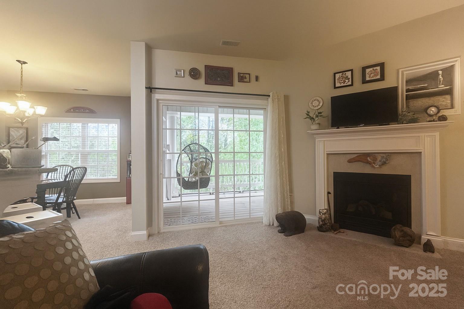 1350 21st Avenue Northeast Hickory, NC 28601 - Photo 8 of 27 a living room with furniture and a fireplace