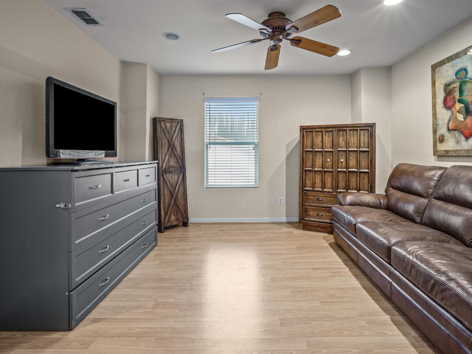 10893 Woolwich Way Mather, CA 95655 - Photo 11 of 24 a living room with furniture and a flat screen tv