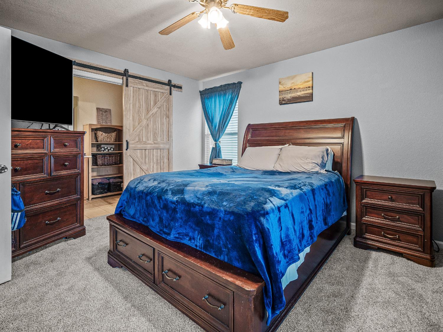 10893 Woolwich Way Mather, CA 95655 - Photo 12 of 24 a bedroom with a bed and a television