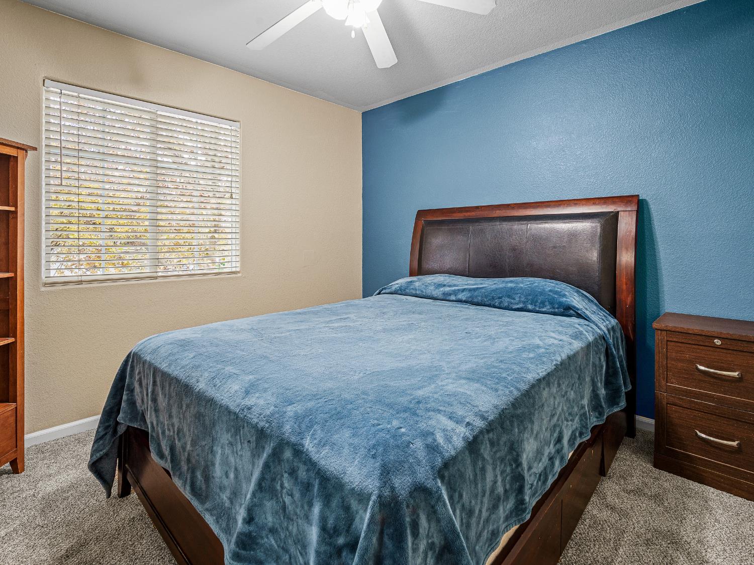 10893 Woolwich Way Mather, CA 95655 - Photo 14 of 24 a bedroom with a bed and a dresser