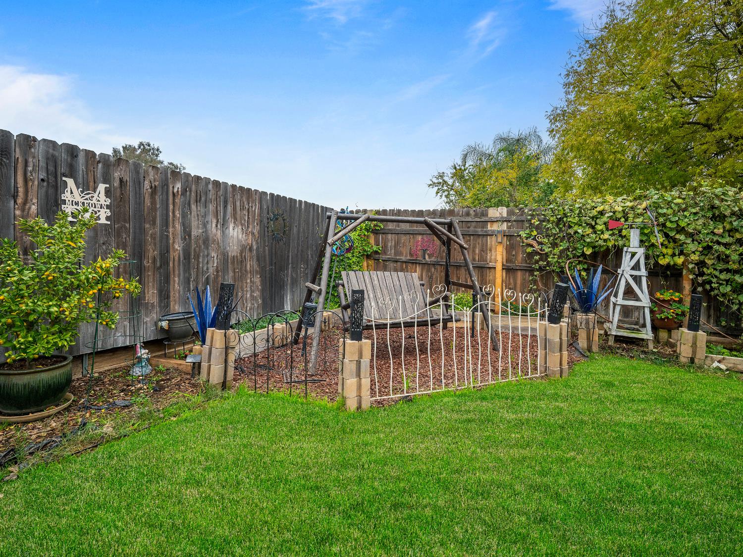 10893 Woolwich Way Mather, CA 95655 - Photo 20 of 24 a view of a house with a backyard and a patio