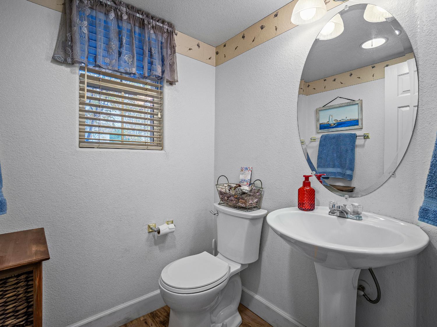 10893 Woolwich Way Mather, CA 95655 - Photo 9 of 24 a bathroom with a sink toilet and a mirror