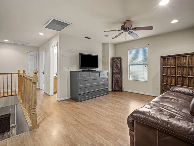 a view of a livingroom with furniture and a flat screen tv