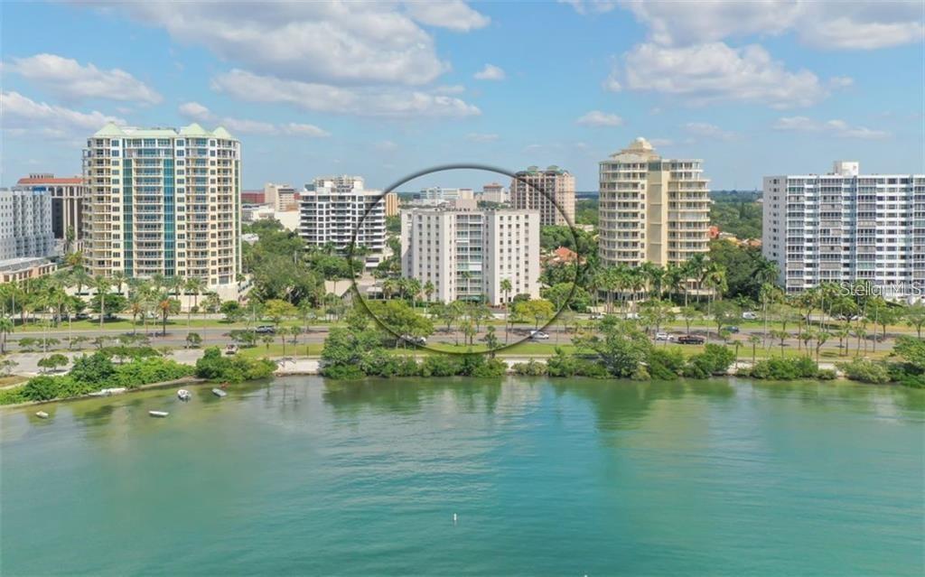 435 South Gulfstream Avenue, Unit 702 Sarasota, FL 34236 - Photo 1 of 23 a view of a city with tall buildings and a lake