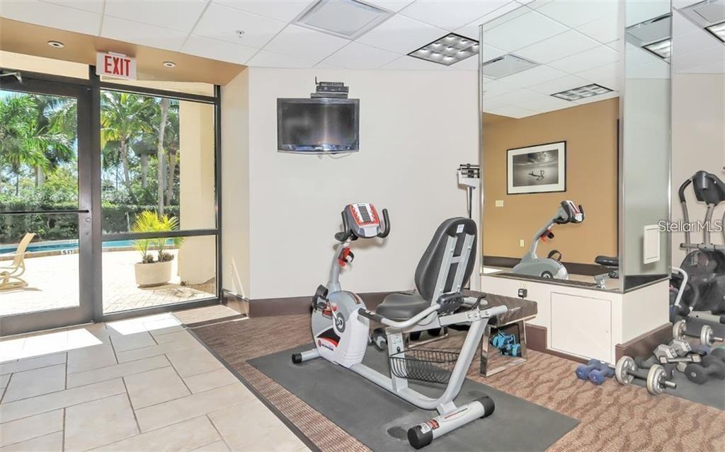 435 South Gulfstream Avenue, Unit 702 Sarasota, FL 34236 - Photo 15 of 23 a view of a workspace with furniture and a window