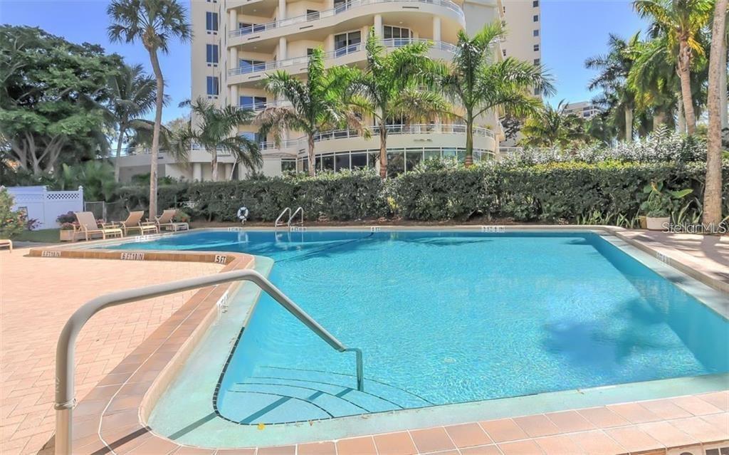 435 South Gulfstream Avenue, Unit 702 Sarasota, FL 34236 - Photo 3 of 23 a view of swimming pool with outdoor seating and plants