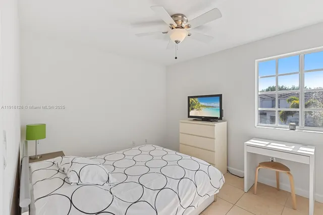 a bedroom with a bed and a table