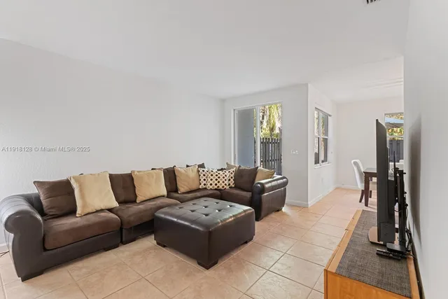 a living room with furniture and a rug