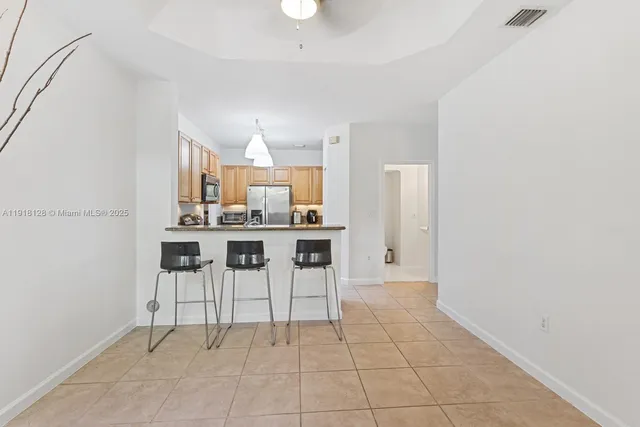 a kitchen with stainless steel appliances a sink cabinets and a stove top oven