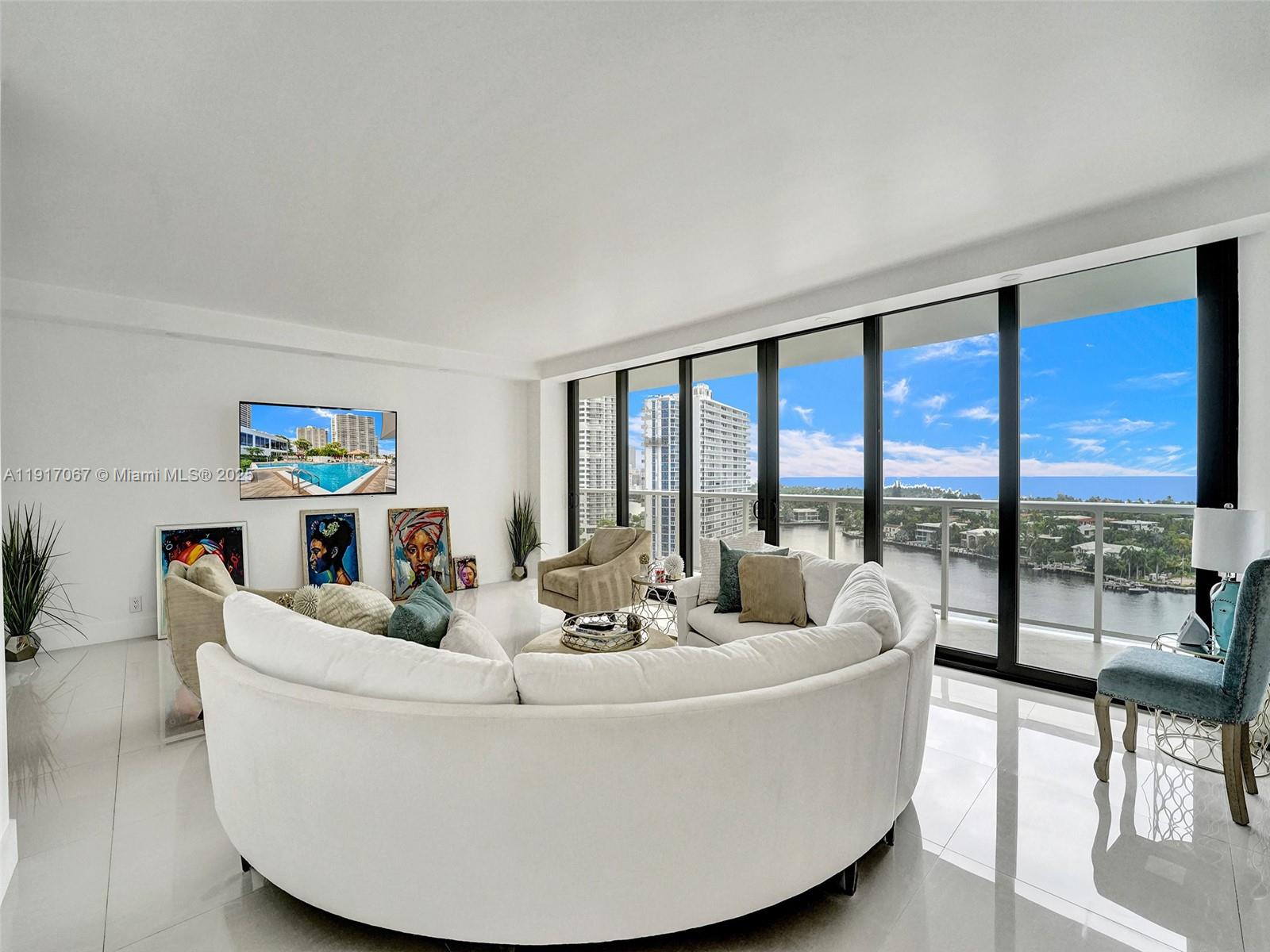 20281 East Country Club Drive, Unit 1114 Aventura, FL 33180 - Photo 13 of 87 a living room with furniture and a large window