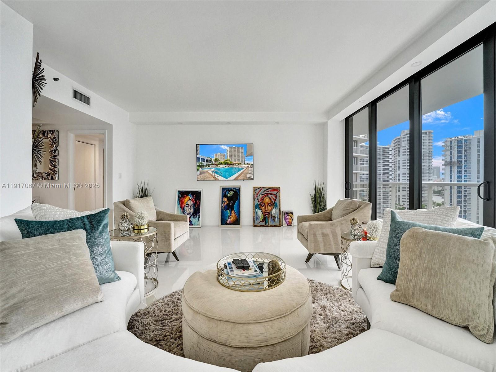 20281 East Country Club Drive, Unit 1114 Aventura, FL 33180 - Photo 14 of 87 a living room with furniture and a large window