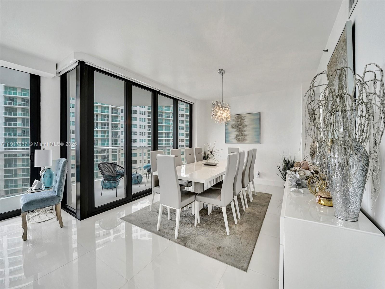 20281 East Country Club Drive, Unit 1114 Aventura, FL 33180 - Photo 15 of 87 a dining room with furniture and wooden floor