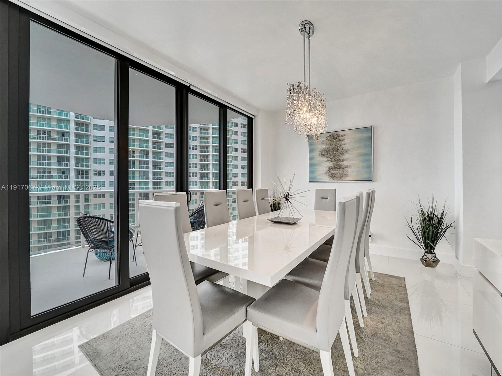 20281 East Country Club Drive, Unit 1114 Aventura, FL 33180 - Photo 16 of 87 a view of a dining room with furniture window and wooden floor