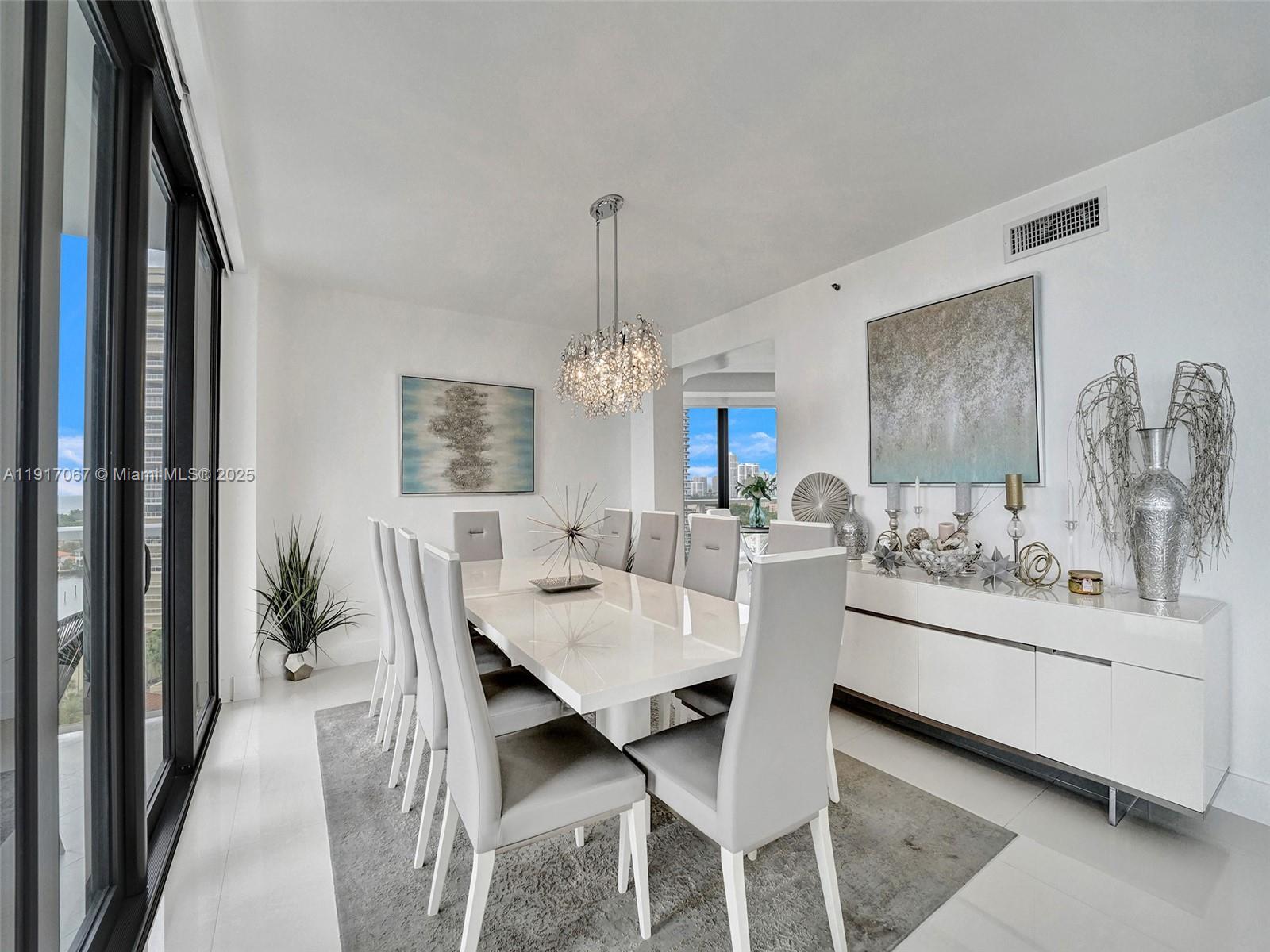 20281 East Country Club Drive, Unit 1114 Aventura, FL 33180 - Photo 17 of 87 a view of a dining room with furniture and window