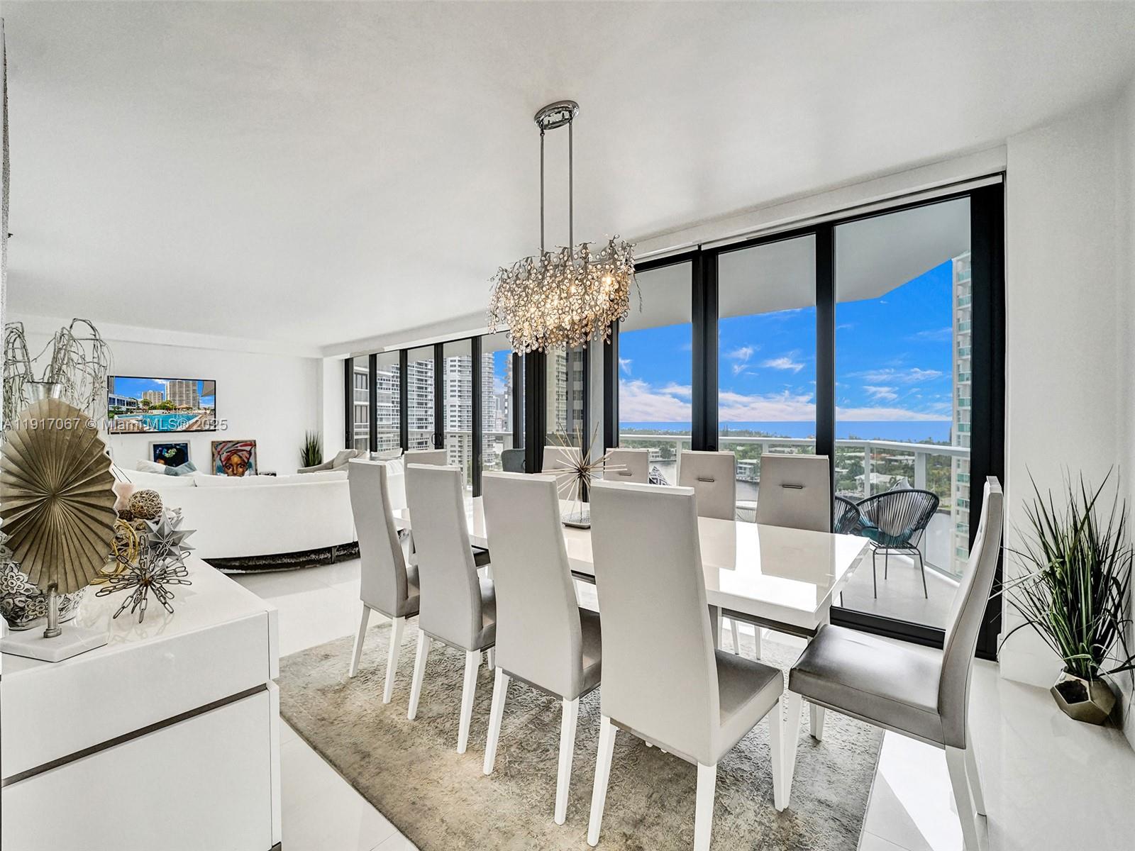 20281 East Country Club Drive, Unit 1114 Aventura, FL 33180 - Photo 18 of 87 a view of a dining room with furniture window and outside view