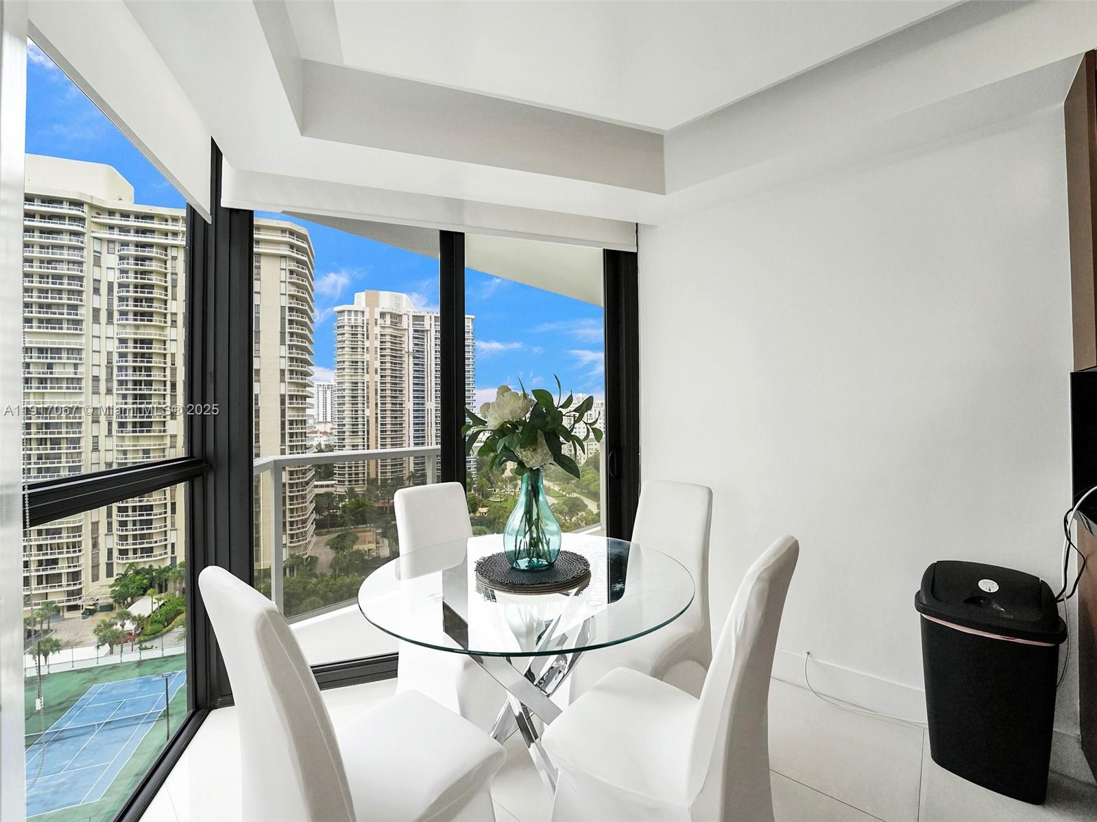 20281 East Country Club Drive, Unit 1114 Aventura, FL 33180 - Photo 21 of 87 a view of a dining room with furniture window and outside view