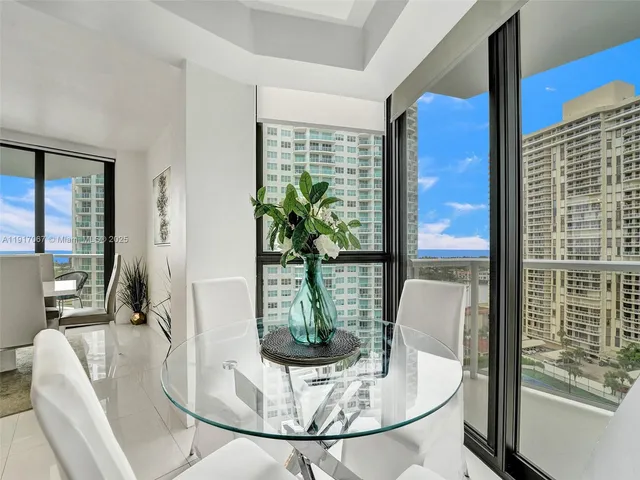 a kitchen with stainless steel appliances granite countertop a refrigerator a stove top oven a sink dishwasher and cabinets with wooden floor