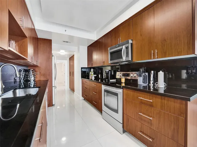 a bedroom with a bed and a large mirror