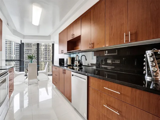 a bedroom with two beds and painting on the wall