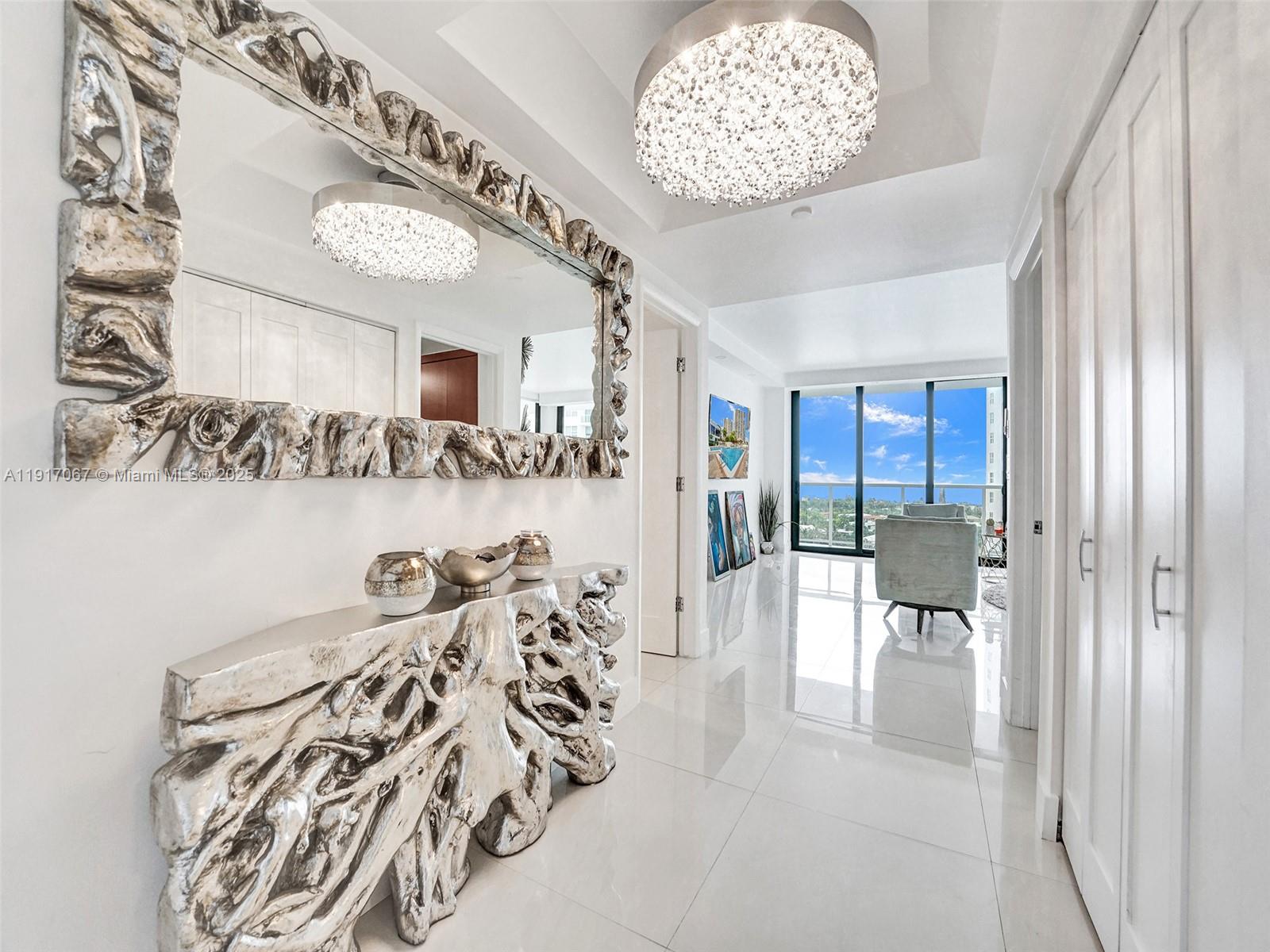 20281 East Country Club Drive, Unit 1114 Aventura, FL 33180 - Photo 3 of 87 a view of a livingroom with furniture and a chandelier