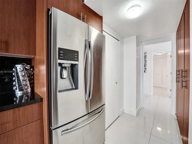 a bedroom with two beds and painting on the wall